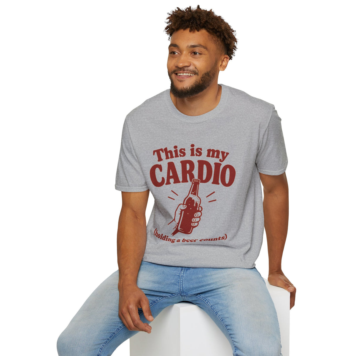This Is My Cardio Shirt, Sport Grey, worn by a model seated on a white block