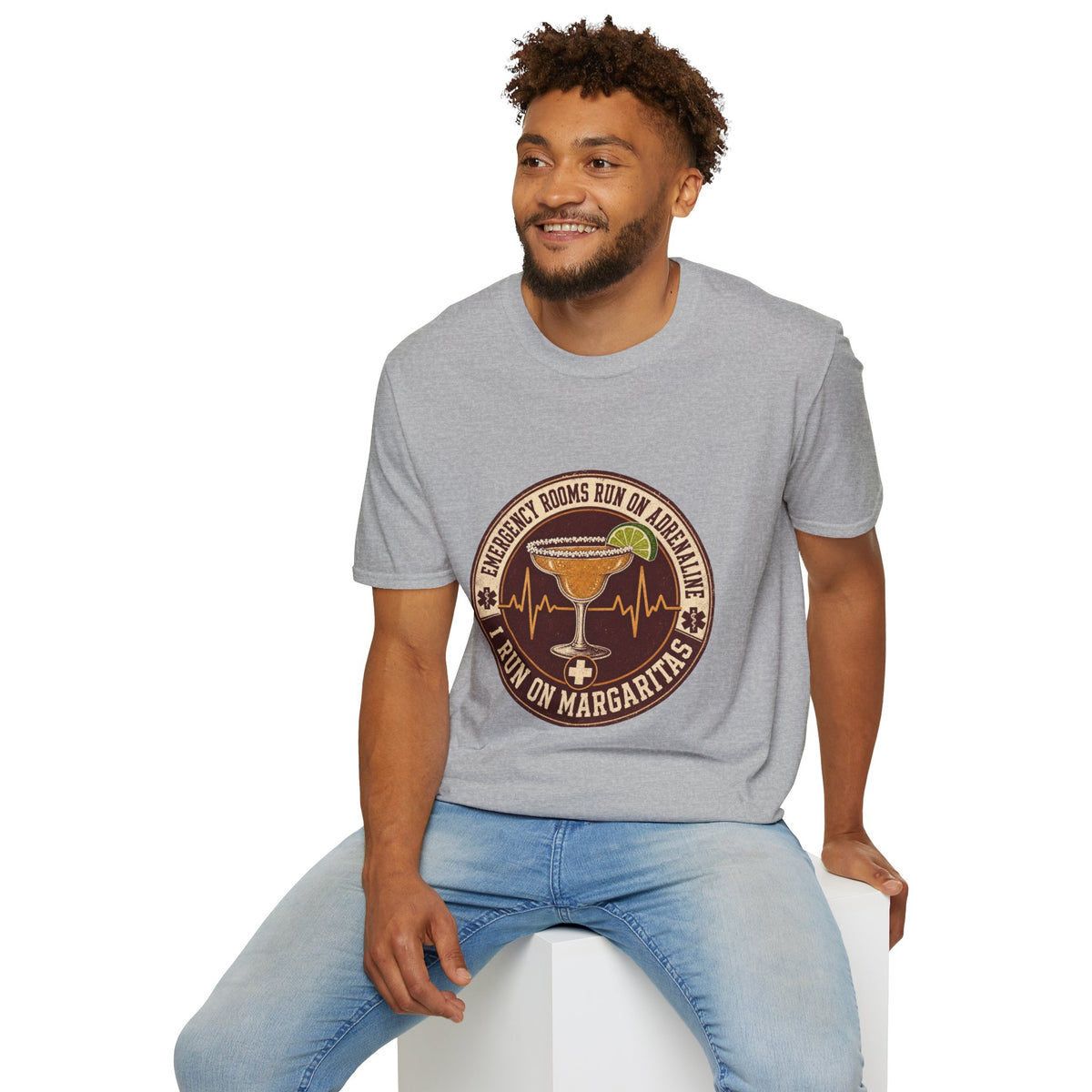 Emergency Rooms Run on Adrenaline Shirt, Sport Grey, worn by a model seated on a white block