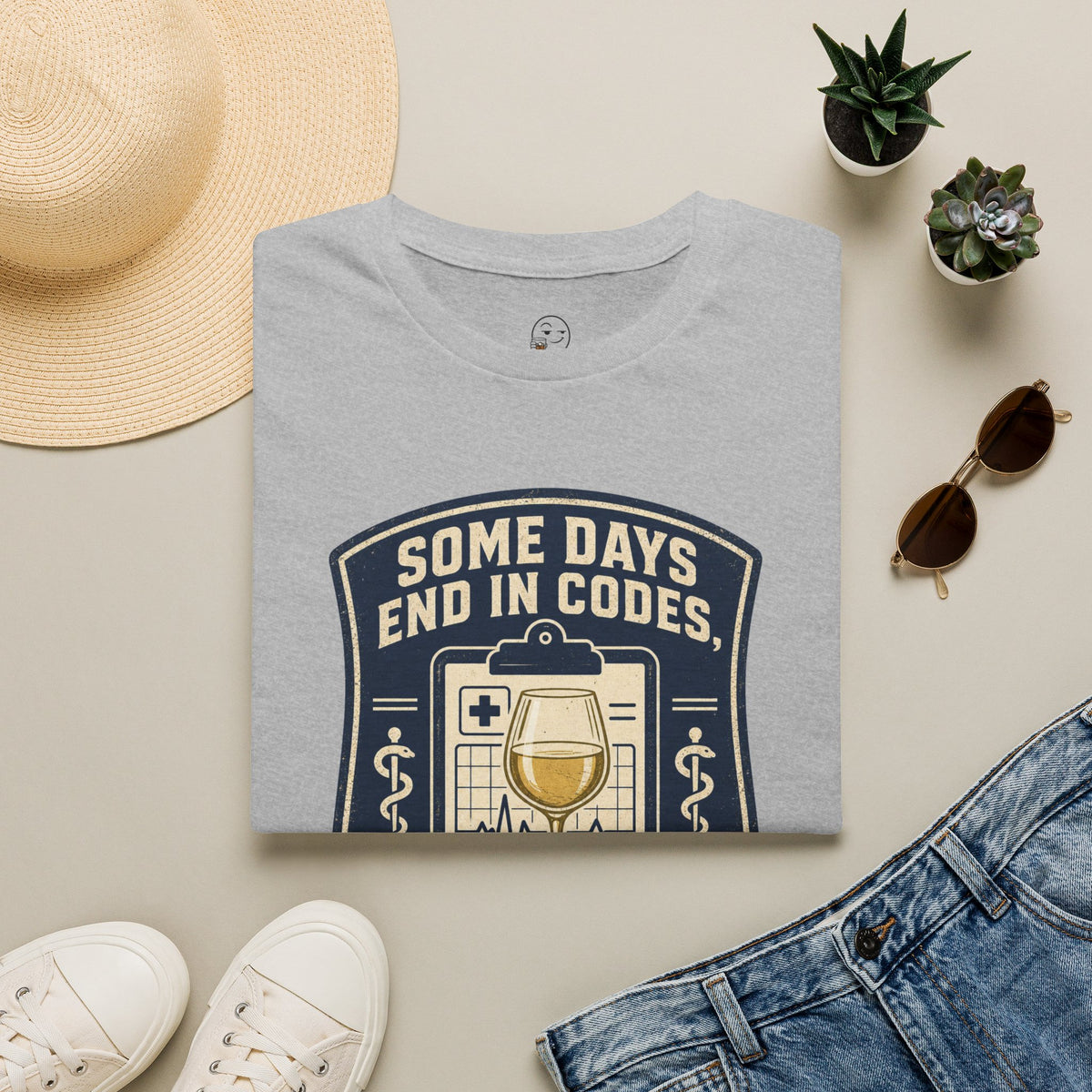 Some Days End in Codes Shirt, Sport Grey, folded flat lay styled with a straw hat, sunglasses, sneakers and denim