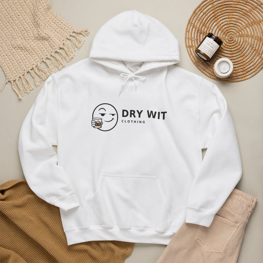 Dry Wit Clothing logo hoodie with winking emoji holding a whiskey glass, White, flat lay styled with a knit throw, candle and tan trousers