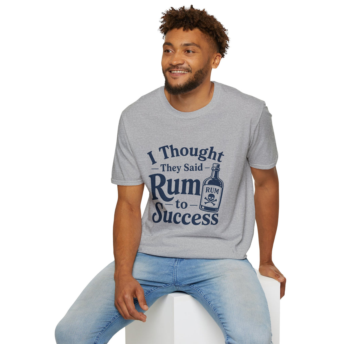I Thought They Said Rum to Success Shirt, Sport Grey, worn by a model seated on a white block