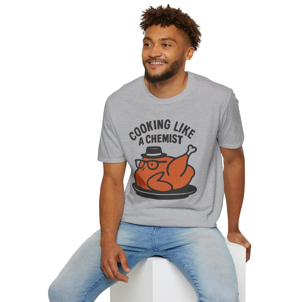 Cooking Like a Chemist funny Thanksgiving turkey t-shirt, Sport Grey, man seated on a stool wearing the shirt