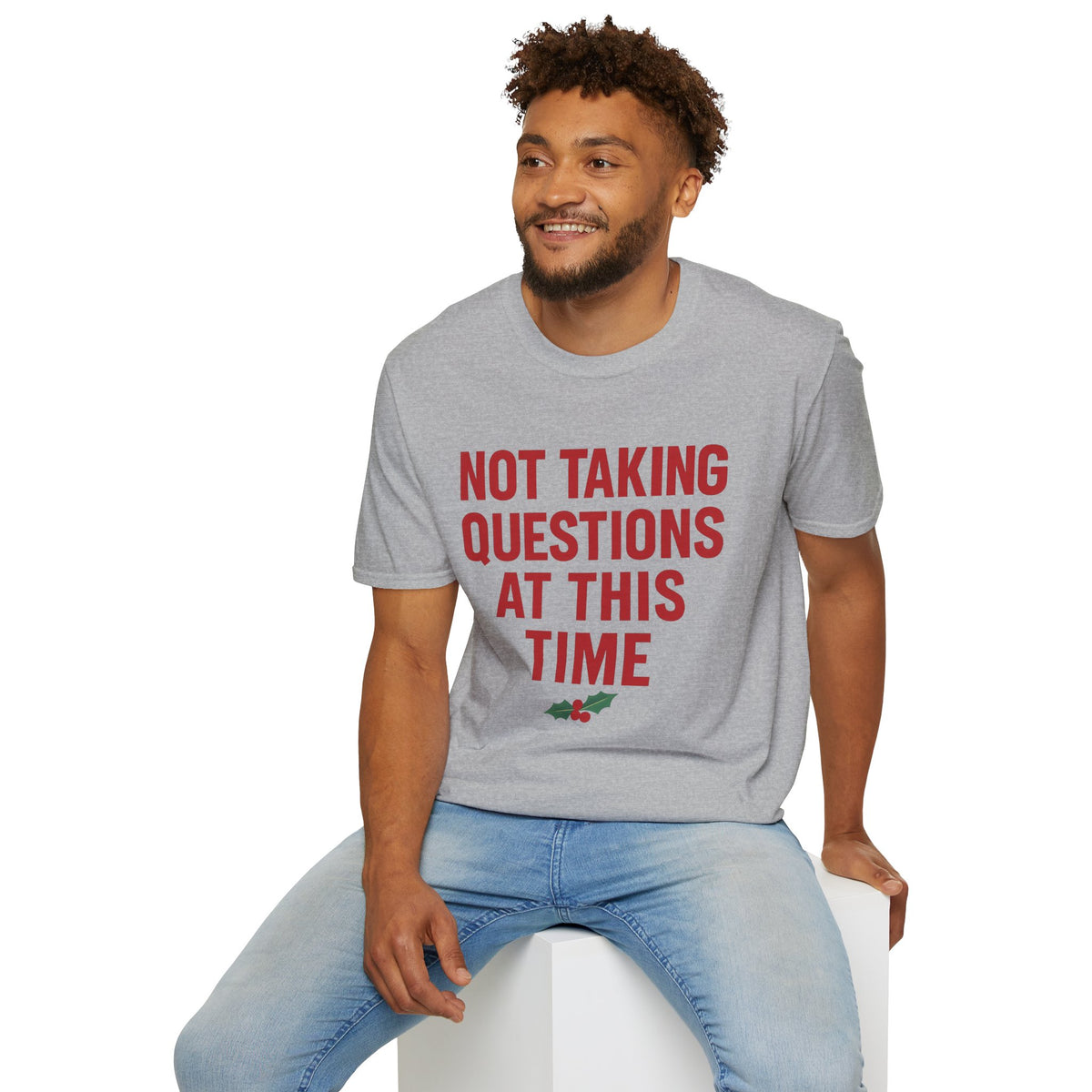 Not Taking Questions at This Time Shirt, Sport Grey, worn by a model seated on a white block