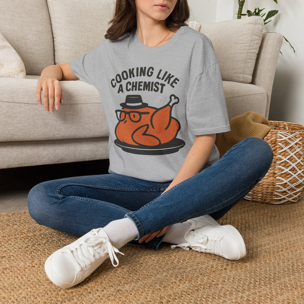 Cooking Like a Chemist funny Thanksgiving turkey t-shirt, Sport Grey, woman sitting on a sofa wearing the shirt