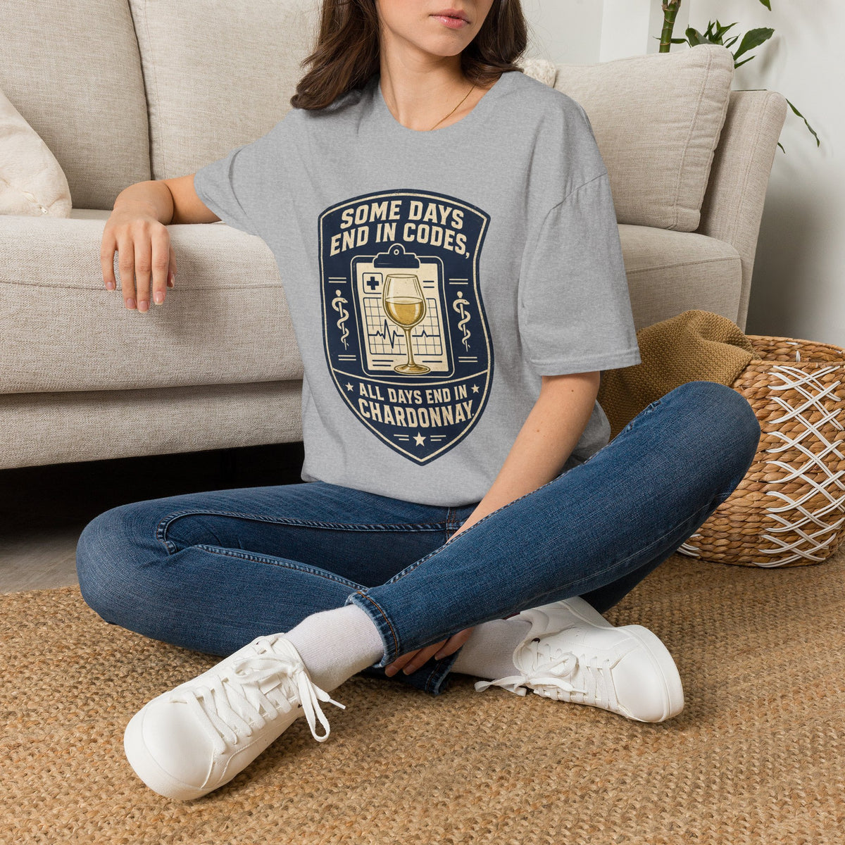 Some Days End in Codes Shirt, Sport Grey, worn by a model seated on the floor beside a sofa