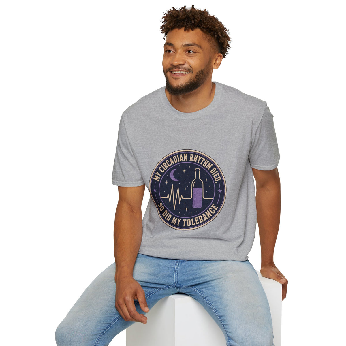 My Circadian Rhythm Died Shirt, Sport Grey, worn by a model seated on a white block