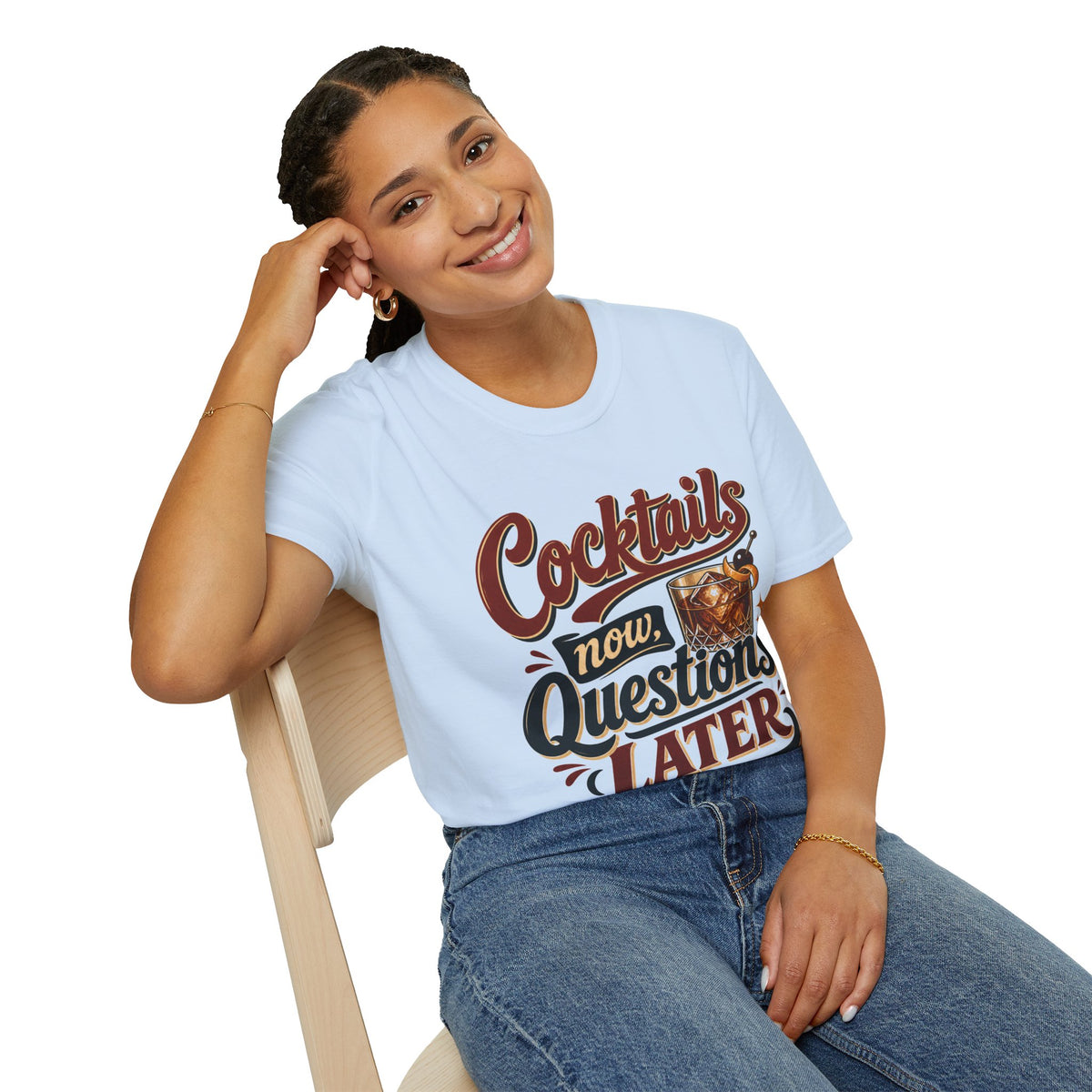 Cocktails Now, Questions Later Shirt, Light Blue, worn by a model seated on a wooden chair