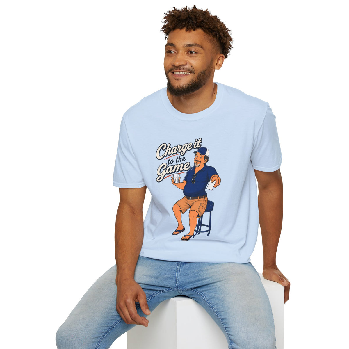 Charge It To The Game Shirt, Light Blue, worn by a model seated on a white block