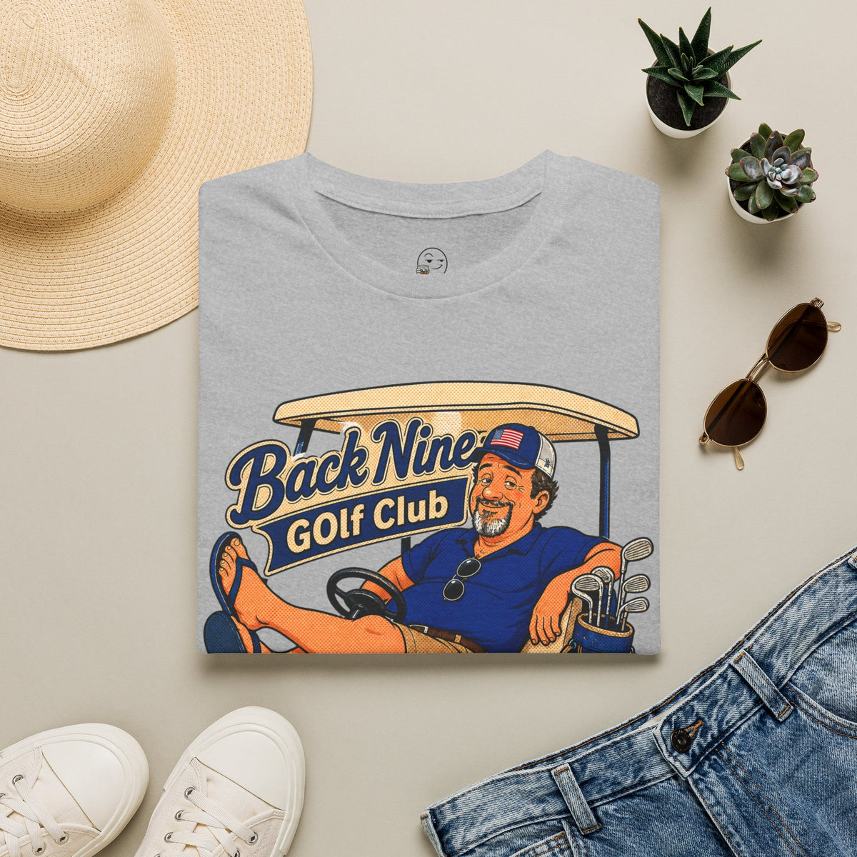 Back Nine Club Shirt, Sport Grey, folded flat lay styled with a straw hat, sunglasses, sneakers and denim