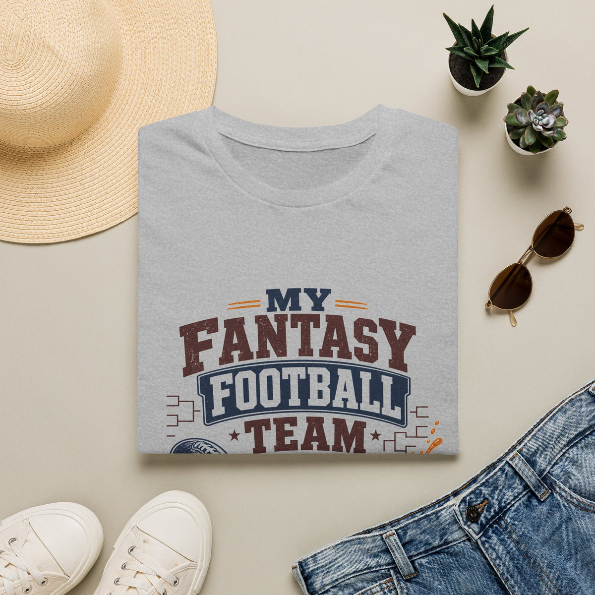 My Team Is Why I Drink Every Sunday Shirt, Sport Grey, folded flat lay styled with a straw hat, sunglasses, sneakers and denim
