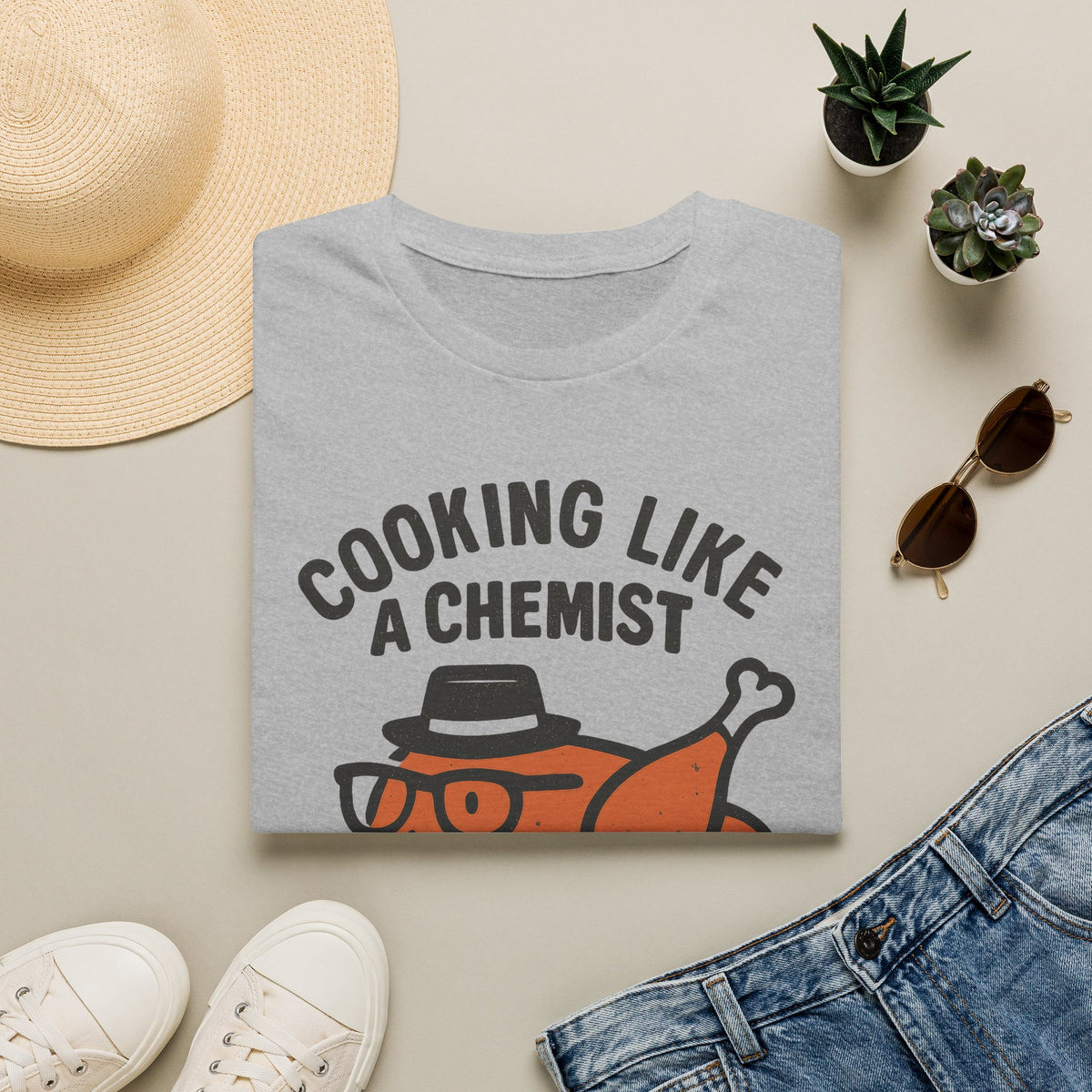 Cooking Like a Chemist funny Thanksgiving turkey t-shirt, Sport Grey, folded flat lay with sunglasses, hat and sneakers