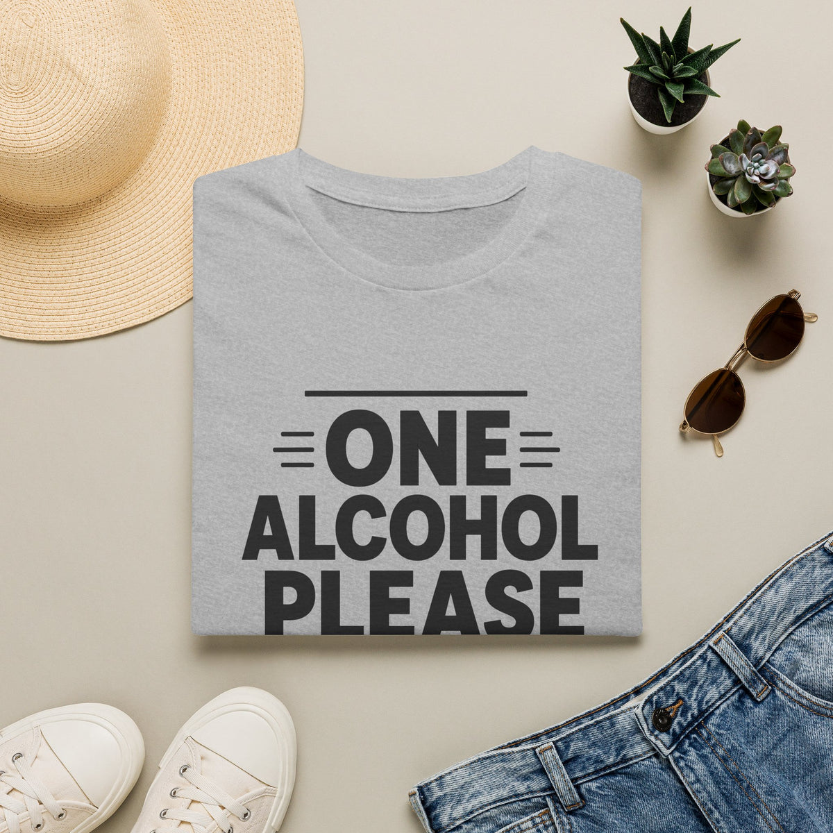 One Alcohol Please Shirt, Sport Grey, folded flat lay styled with a straw hat, sunglasses, sneakers and denim