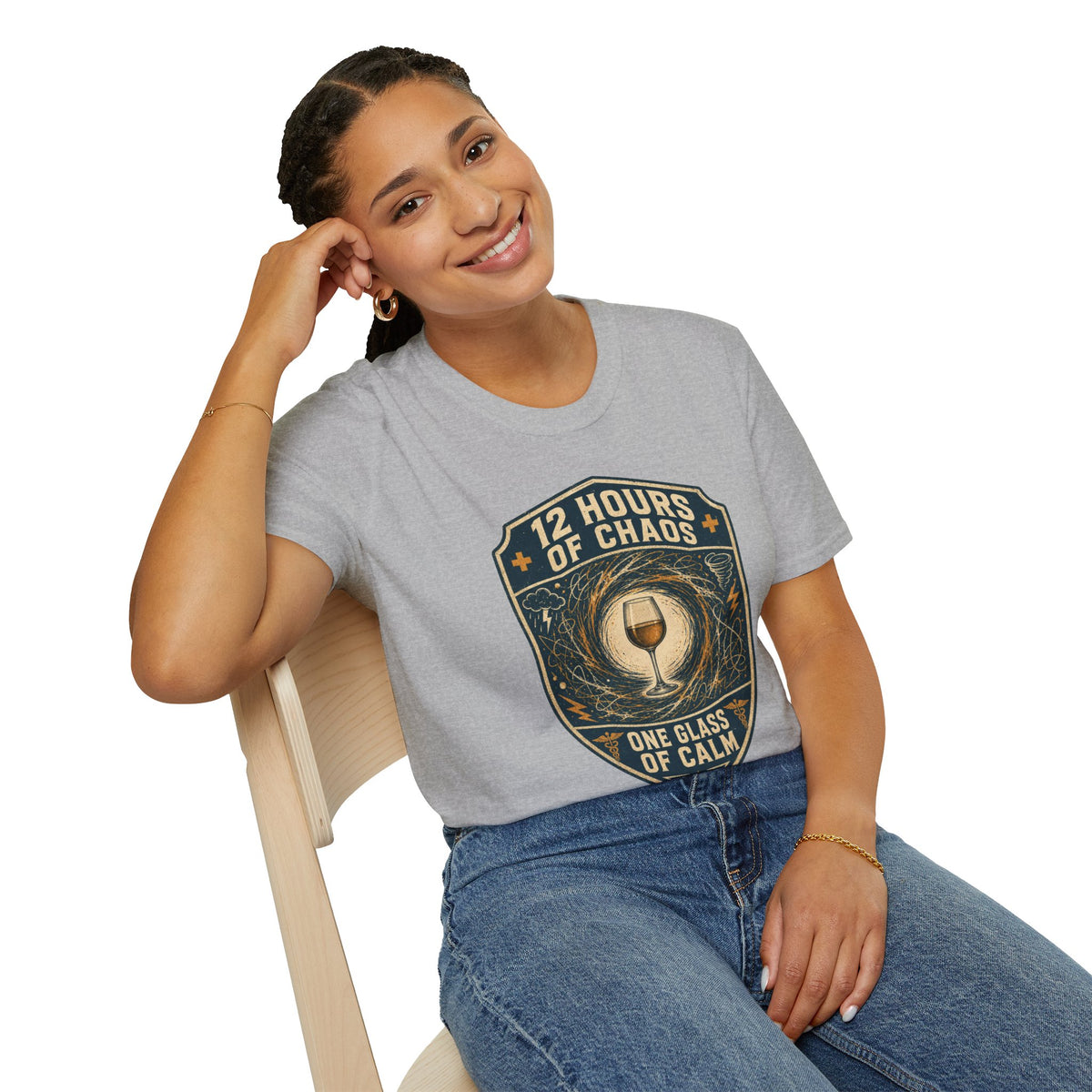 12 Hours of Chaos Shirt, Sport Grey, worn by a model seated on a wooden chair