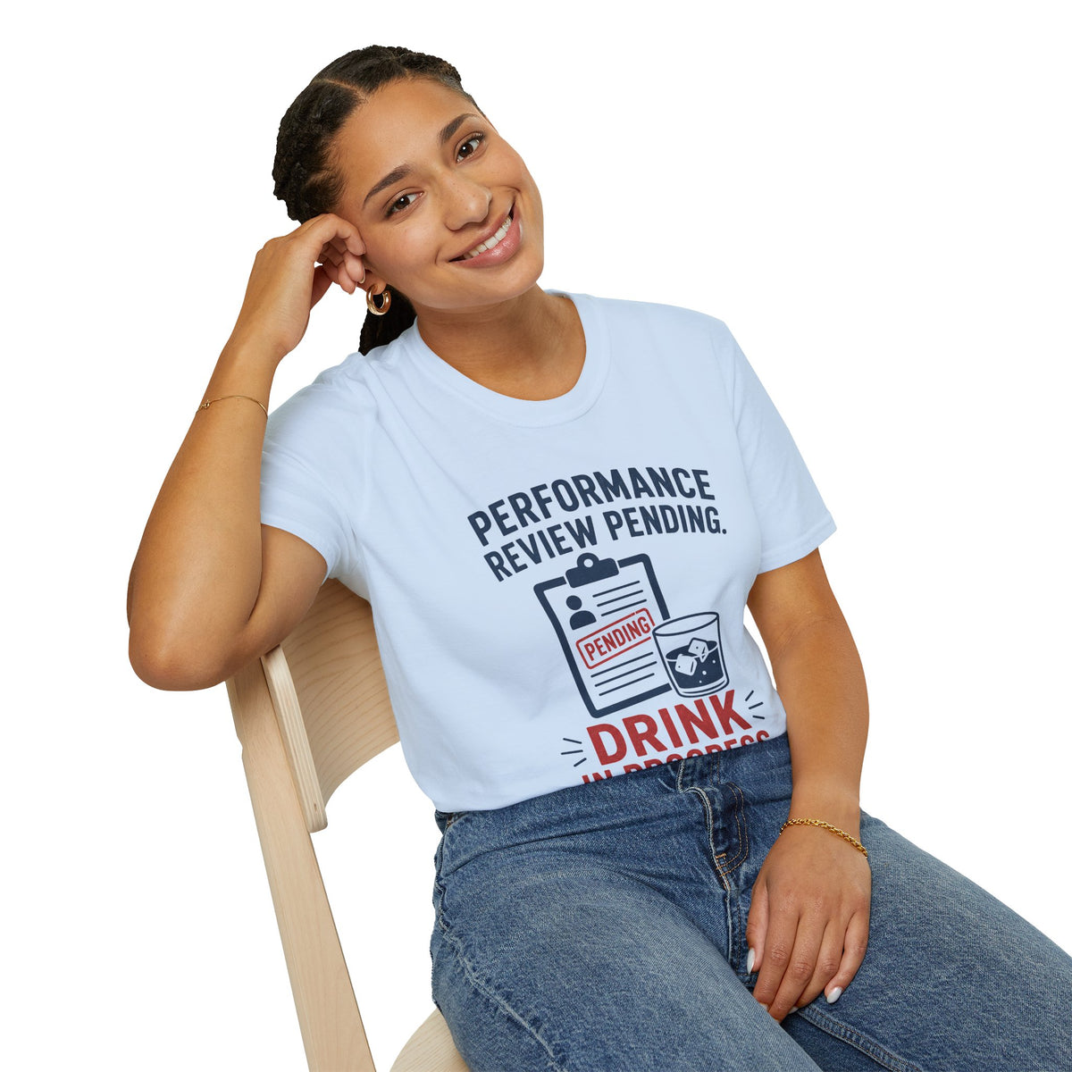 Performance Review Pending Shirt, Light Blue, worn by a model seated on a wooden chair