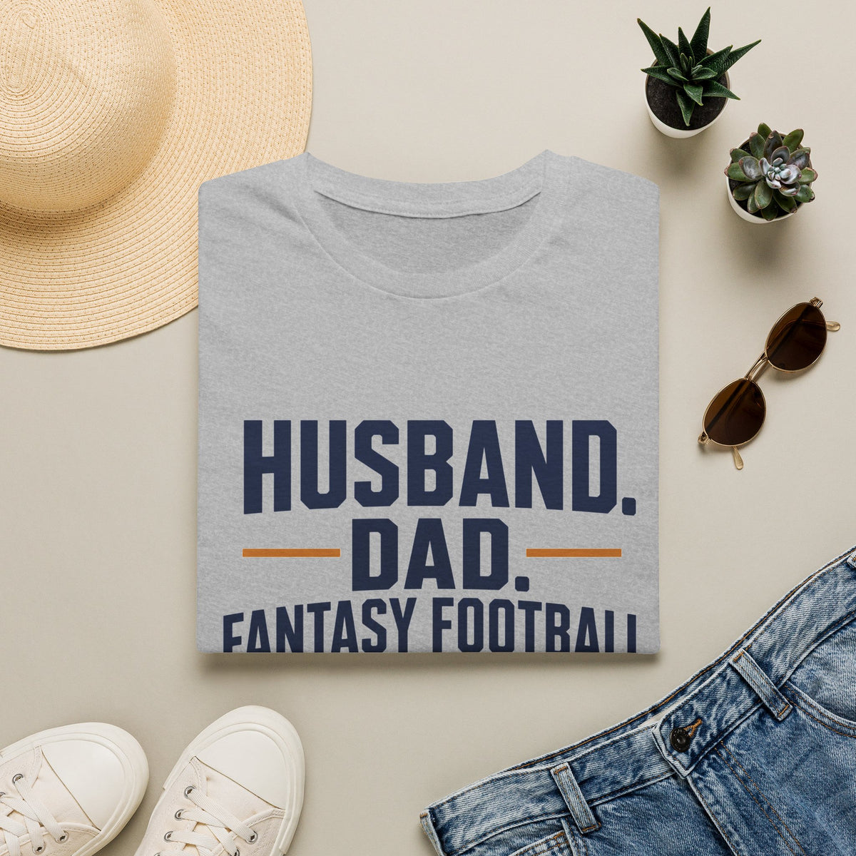 League Champion Shirt, Sport Grey, folded flat lay styled with a straw hat, sunglasses, sneakers and denim