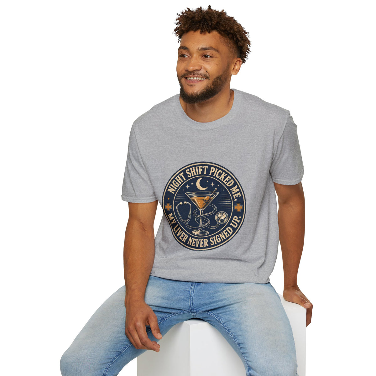 Night Shift Picked Me Shirt, Sport Grey, worn by a model seated on a white block