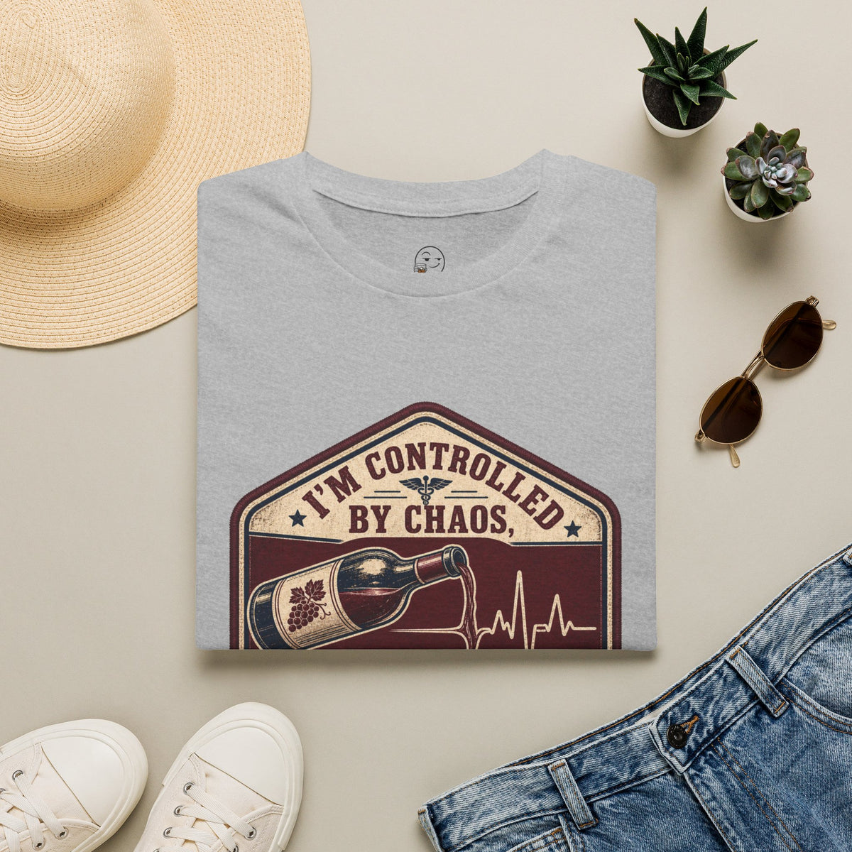 Controlled by Chaos, Uncontrolled Pour Shirt, Sport Grey, folded flat lay styled with a straw hat, sunglasses, sneakers and denim