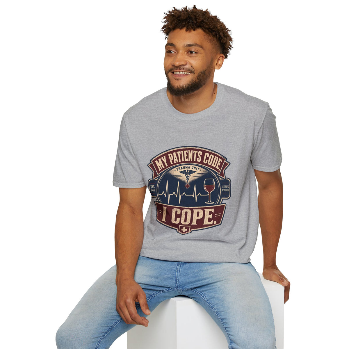 My Patients Code, I Cope Shirt, Sport Grey, worn by a model seated on a white block