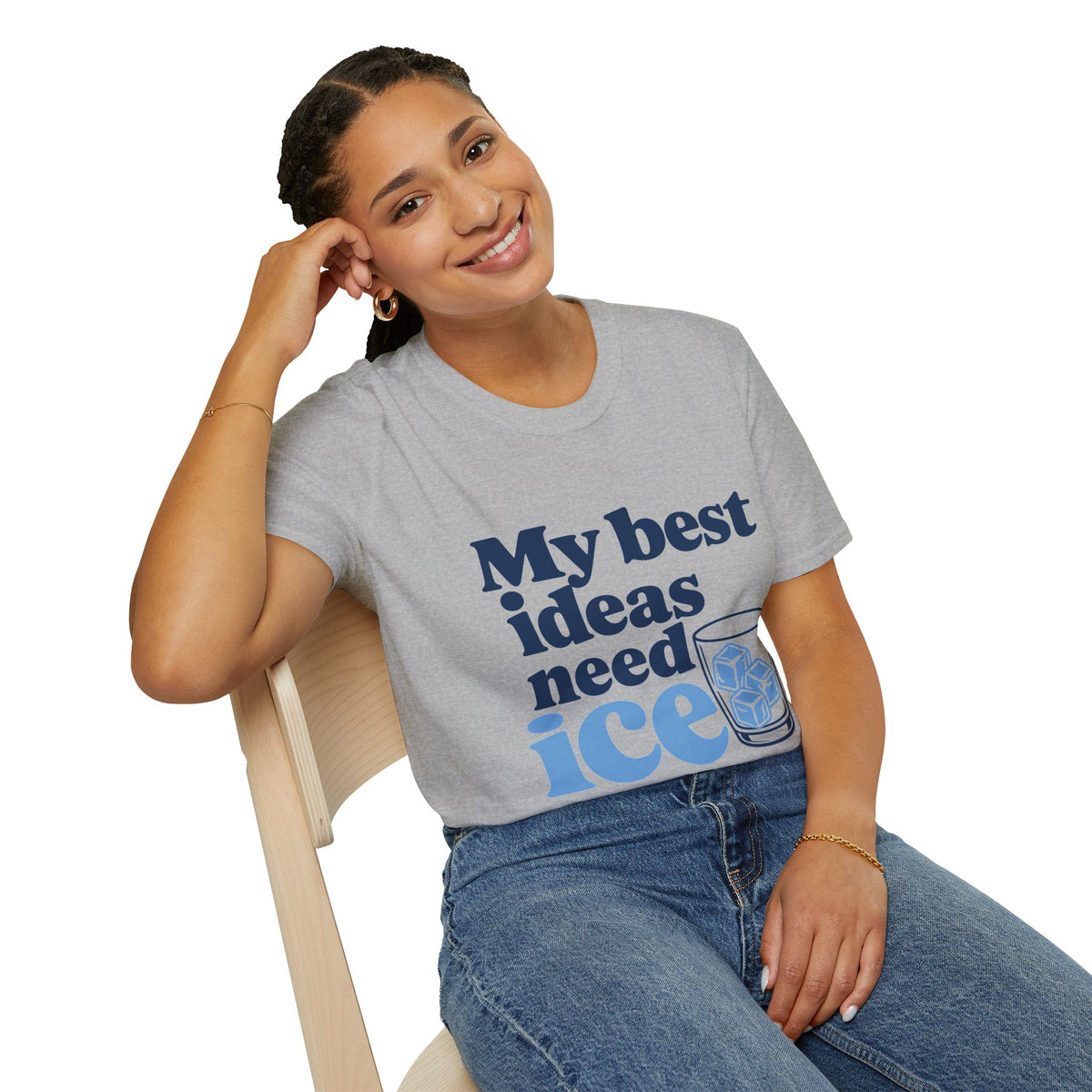 My Best Ideas Need Ice Shirt, Sport Grey, worn by a model seated on a wooden chair