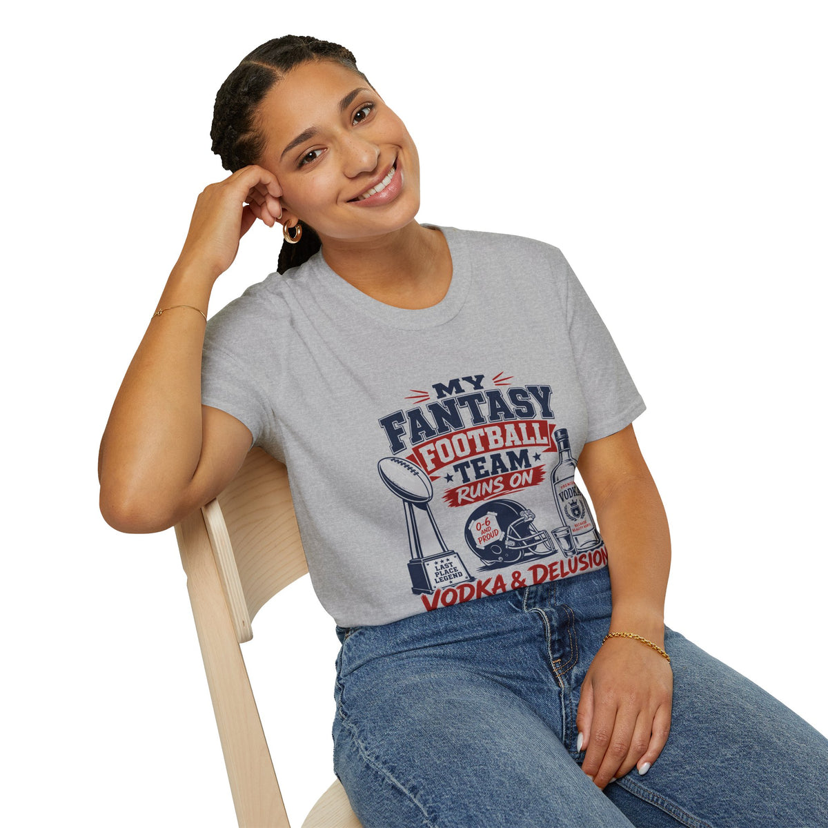My Team Runs on Delusion Shirt, Sport Grey, worn by a model seated on a wooden chair