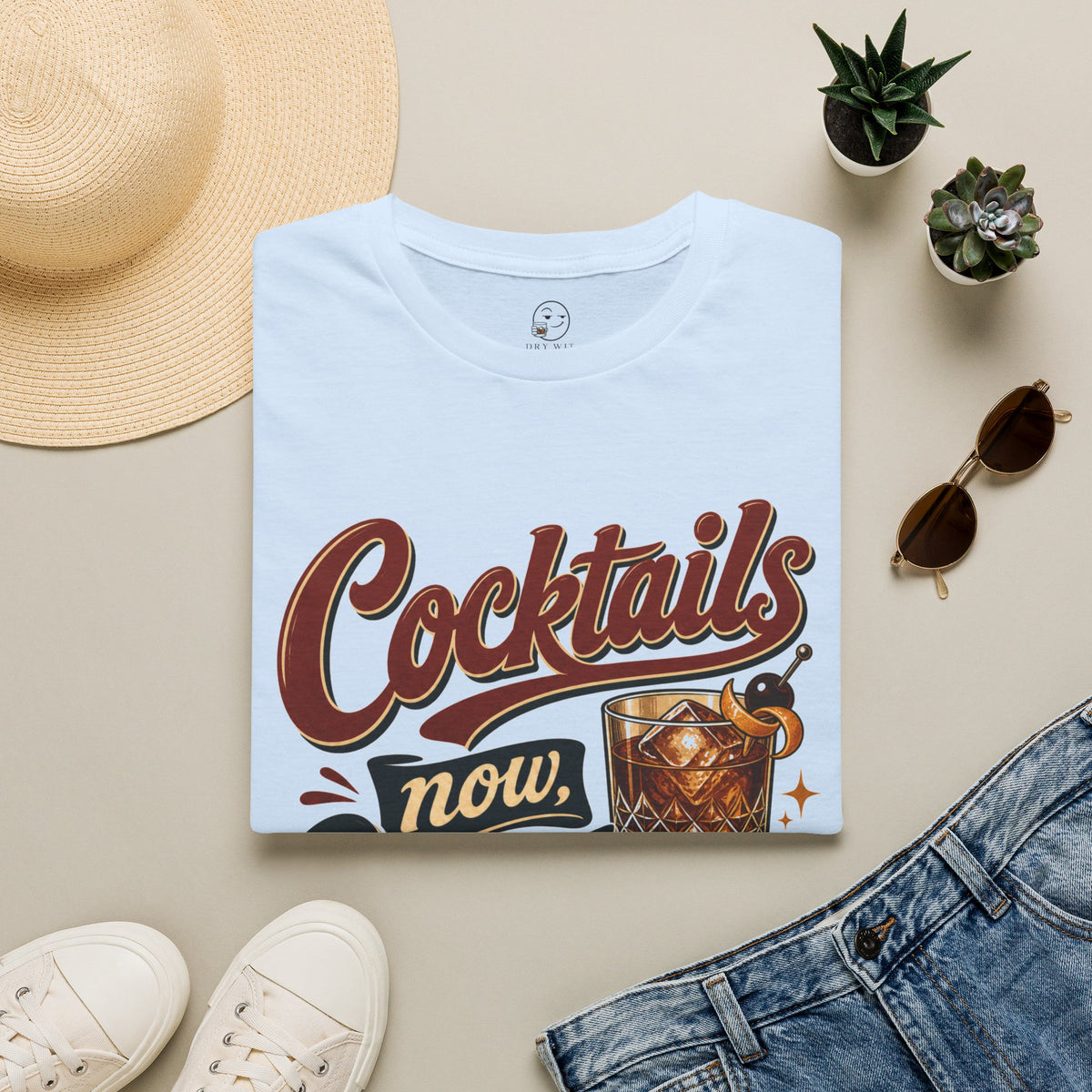 Cocktails Now, Questions Later Shirt, Light Blue, folded flat lay styled with a straw hat, sunglasses, sneakers and denim