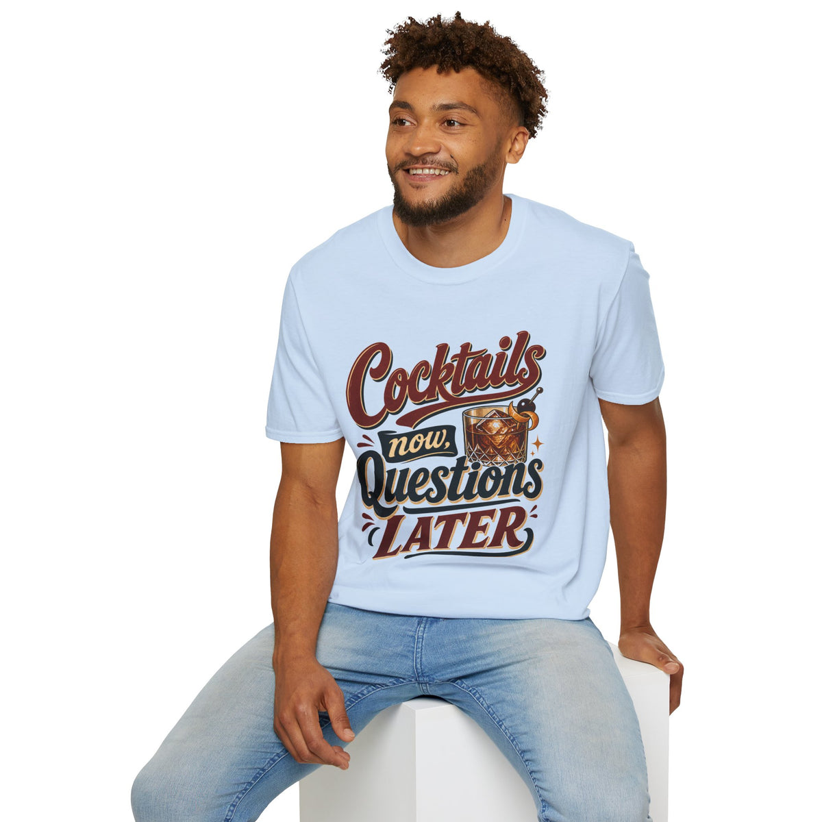 Cocktails Now, Questions Later Shirt, Light Blue, worn by a model seated on a white block