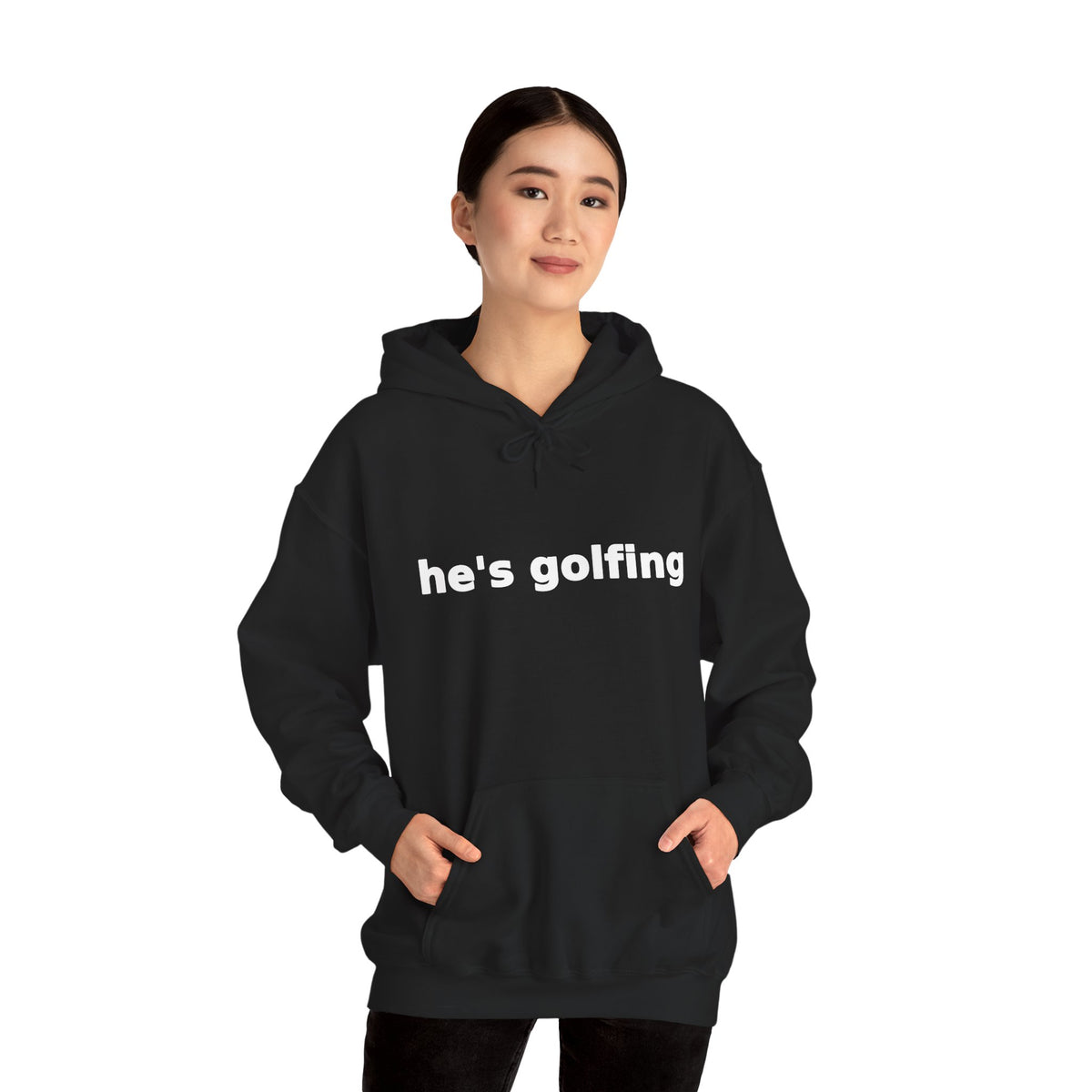 Golf Widow he's golfing funny golf hoodie, Black, worn by a standing model, hands in the front pouch pocket