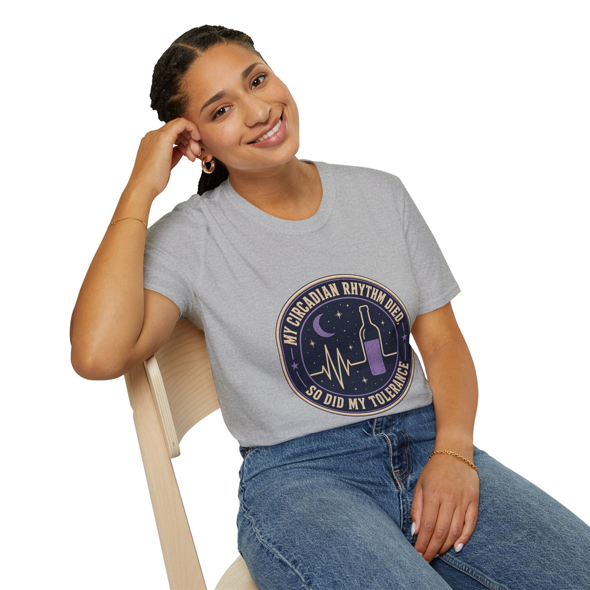 My Circadian Rhythm Died Shirt, Sport Grey, worn by a model seated on a wooden chair