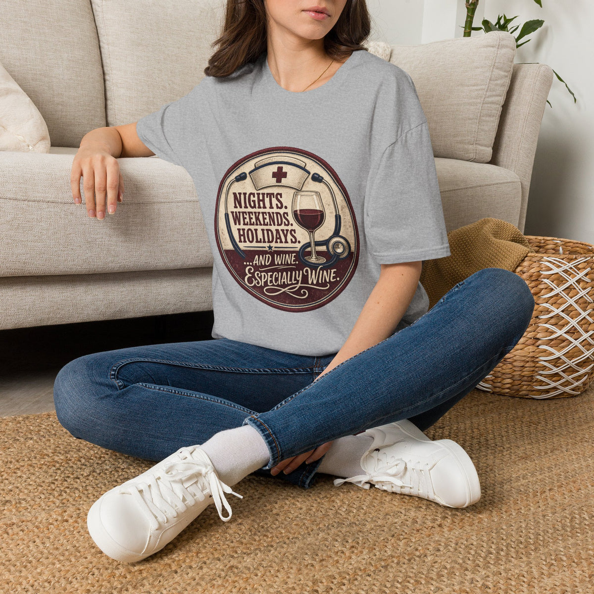 Nights, Weekends, Holidays Shirt, Sport Grey, worn by a model seated on the floor beside a sofa