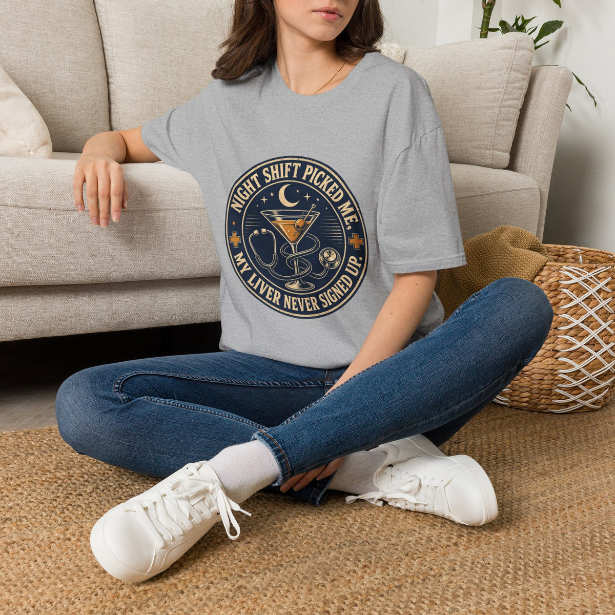 Night Shift Picked Me Shirt, Sport Grey, worn by a model seated on the floor beside a sofa